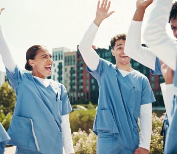 medical-success-doctor-and-celebration-with-hands-2026-01-09-09-42-37-utc-1-scaled.jpg